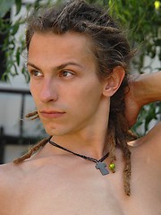 Young rasta boy relaxing in the garden