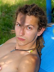 Young rasta boy relaxing in the garden