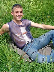 Naughty outdoor enthusiast Hubert playing with his cock on a green meadow