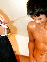 Man in the mask pissing on his asian friend